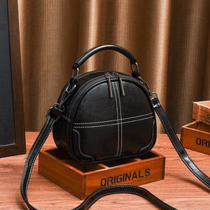 Round Black Patent Leather look Cloth lined Cross body bag
